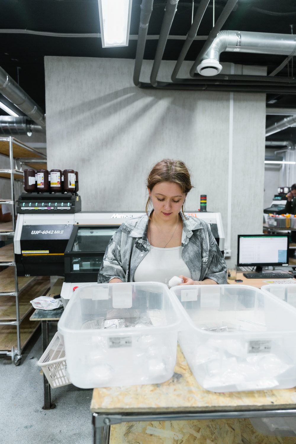 Packing printed cases at the Mimaki UJF-6042 line